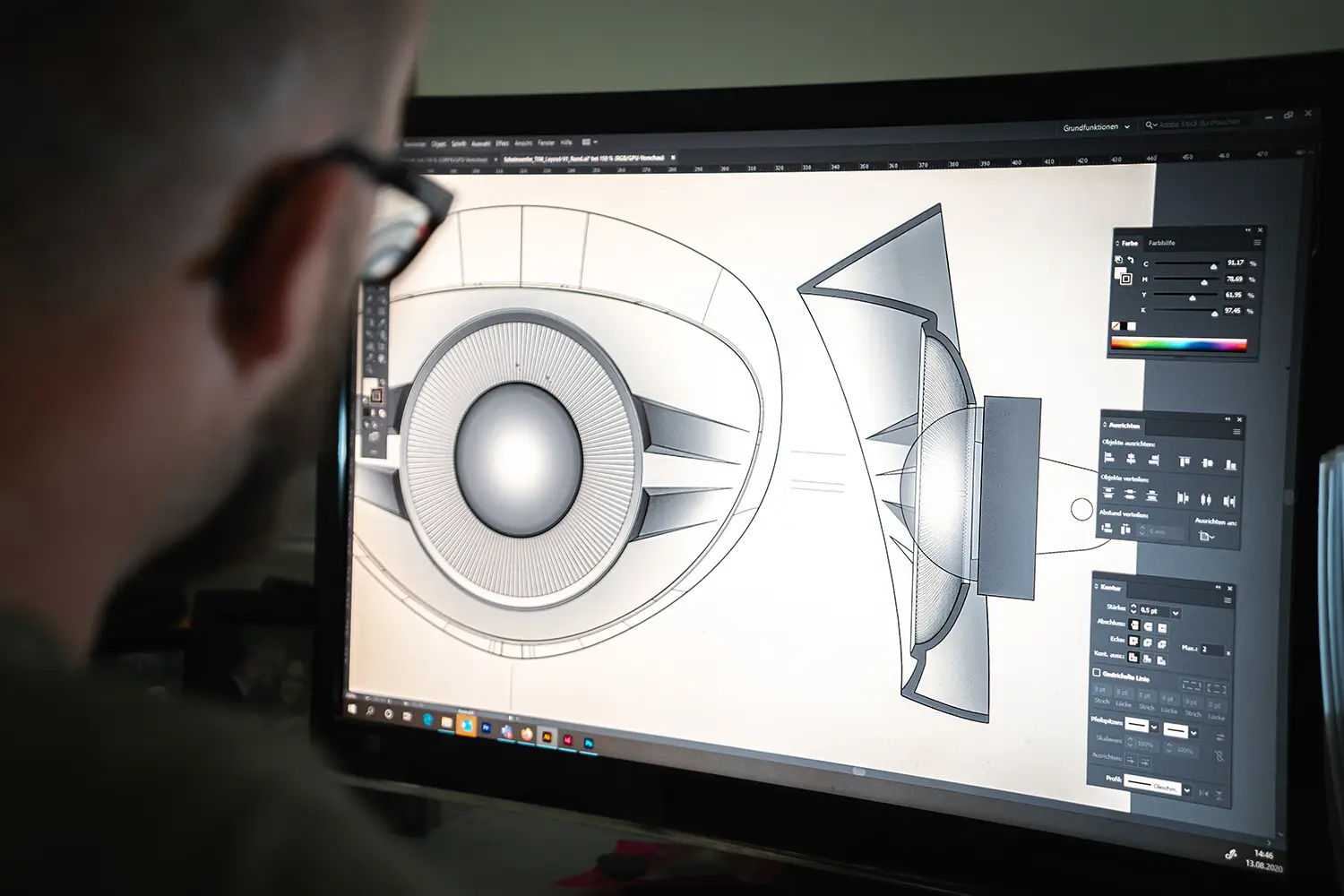 An industrial designer using Adobe Illustrator to draw a product